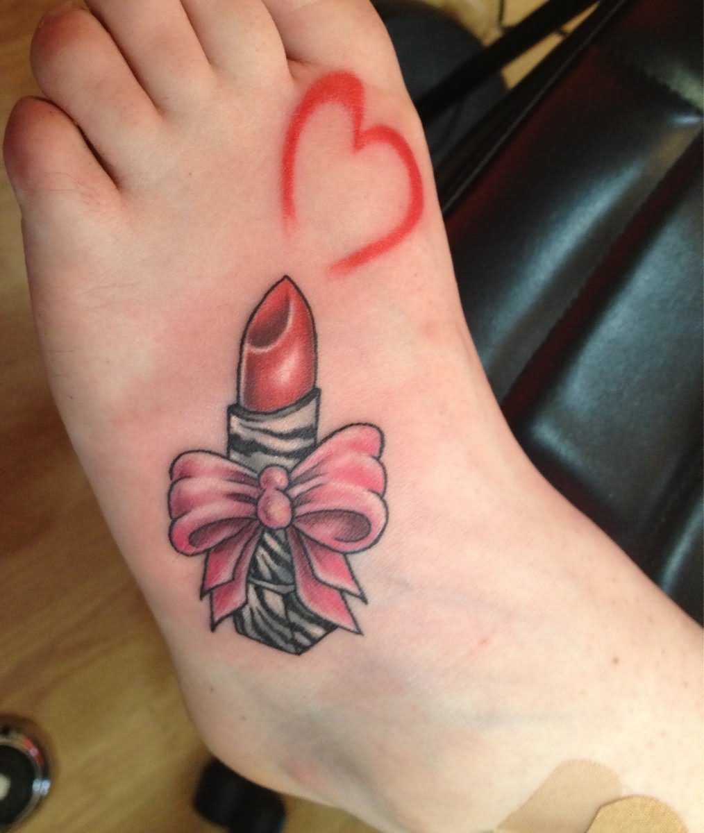 Beautiful Heart And Bow Lipstick Tattoo On Left Foot