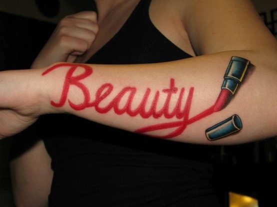 Beauty Lipstick Writing Tattoo On Left Arm