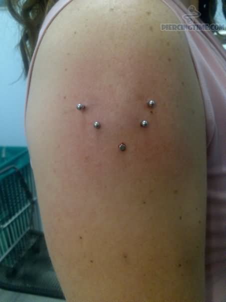 Bicep Piercing With Exotic Silver Studs