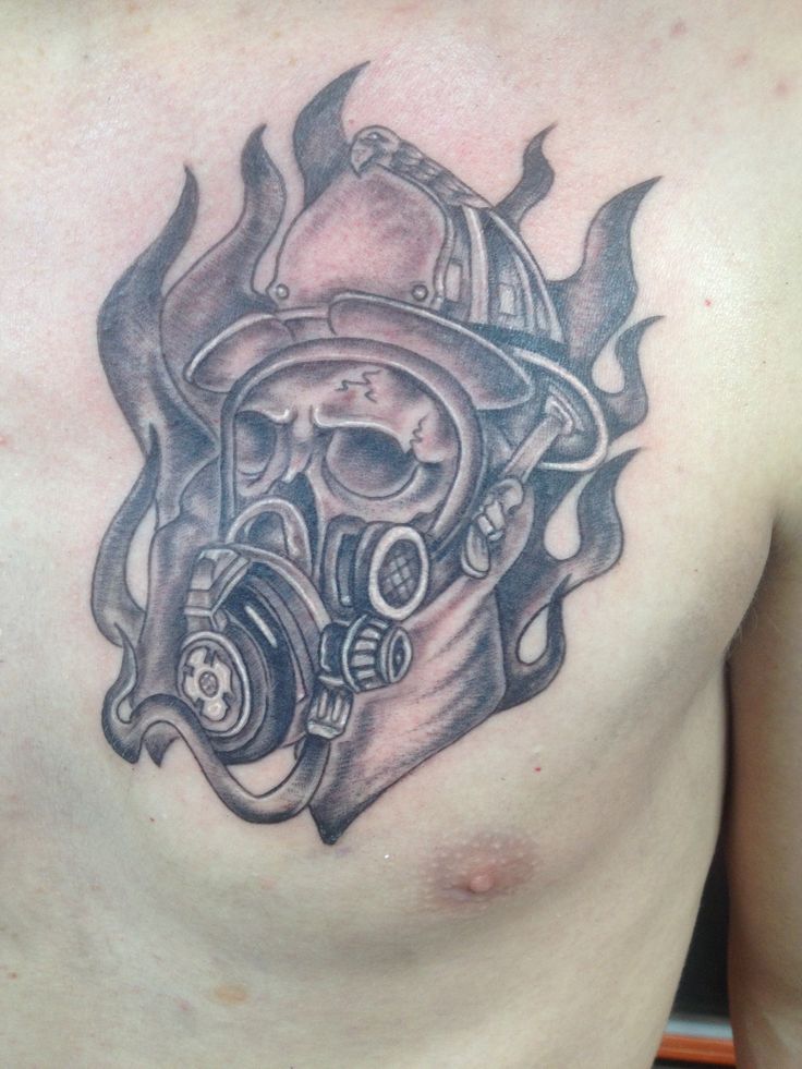 Black And Grey Firefighter Helmet Tattoo On Man Chest