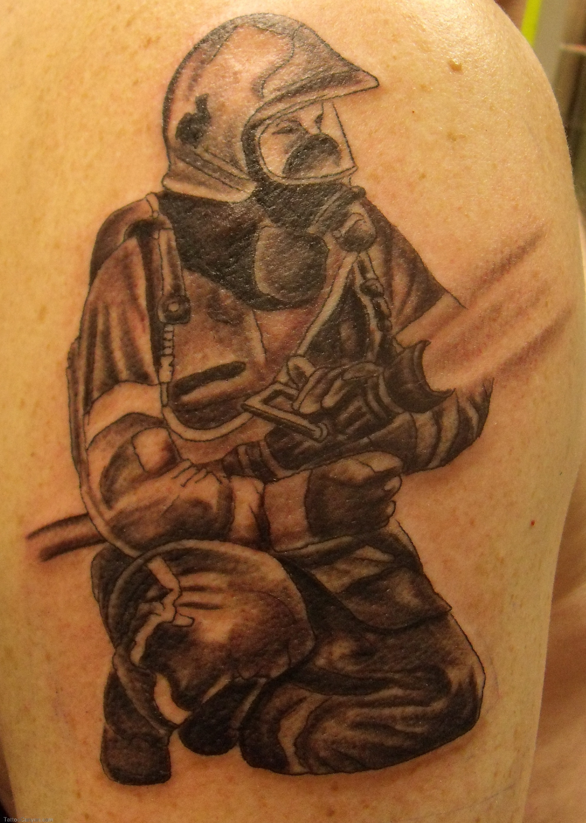 Black And Grey Firefighter Tattoo Design For Shoulder