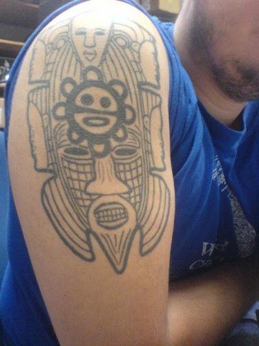 Black And Grey Taino Sun Tattoo On Right Shoulder
