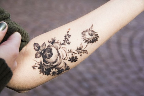 Black And White Floral Tattoo On Girl Left Forearm
