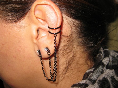 Black Chain Piercings On Girl Left Ear