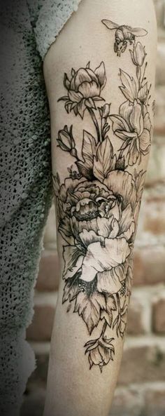 Black Floral Tattoo On Left Arm