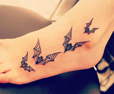 Black Halloween Flying Bats Tattoo On Foot