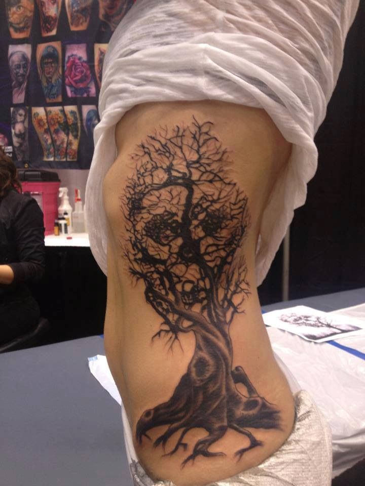 Black Halloween Tree With Skull Tattoo On Side Rib
