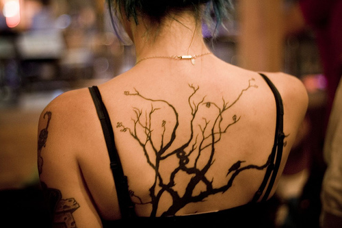 Black Halloween Tree Tattoo On Girl Upper Back