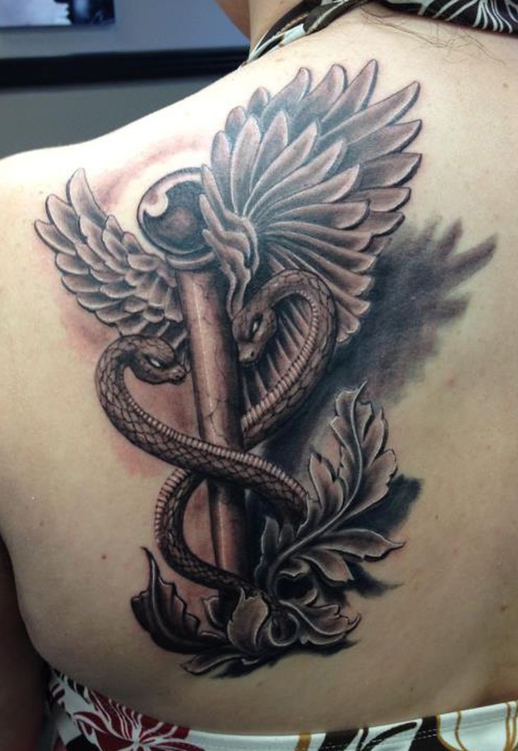 Black Ink 3D Medical Symbol Tattoo On Left Back Shoulder
