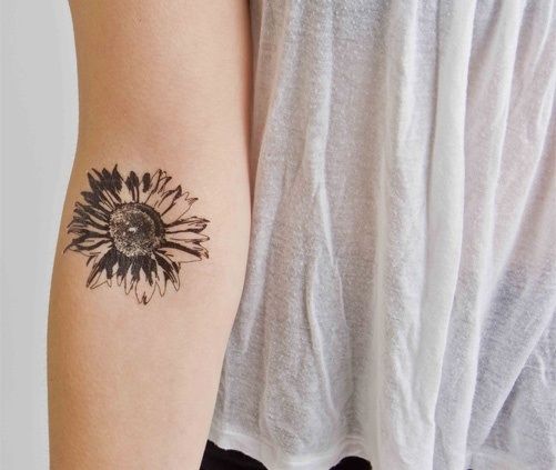 Black Ink Daisy Flower Tattoo On Inside Elbow