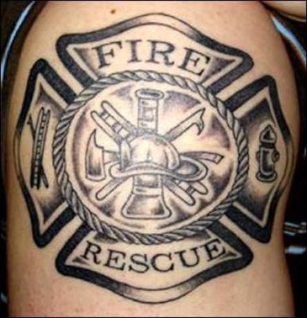 Black Ink Firefighter Cross Tattoo Design For Shoulder