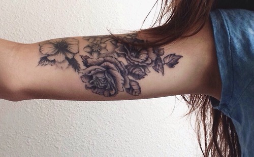 Black Ink Floral Tattoo On Girl Half Sleeve