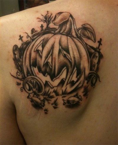 Black Ink Halloween Pumpkin Tattoo On Left Back Shoulder