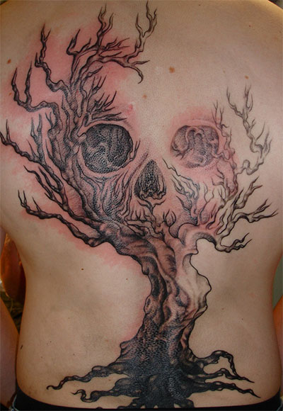 Black Ink Halloween Tree With Skull Tattoo On Upper Back