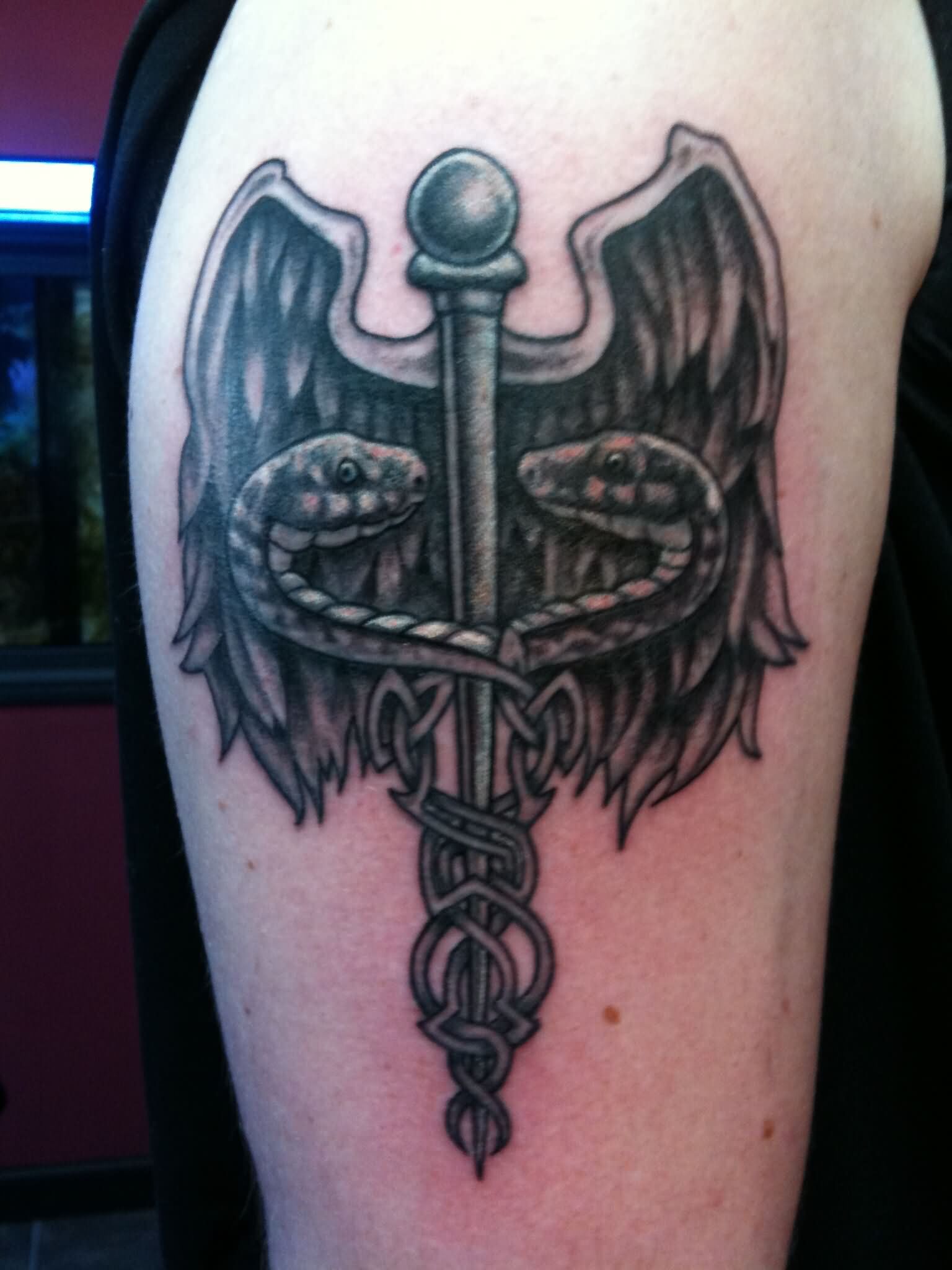 Black Ink Medical Symbol Tattoo On Half Sleeve