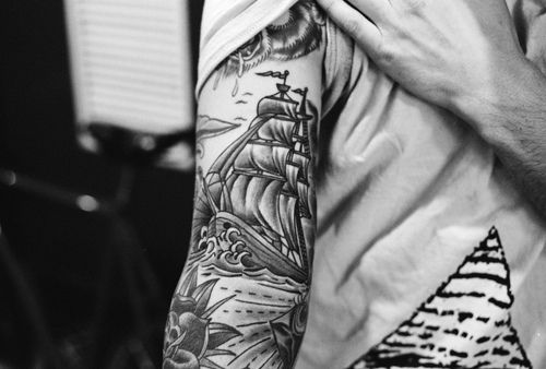 Black Ink Sailor Ship Tattoo On Right Half Sleeve