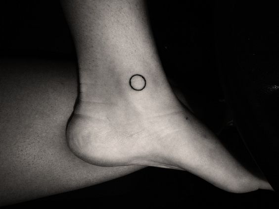 Black Outline Circle Tattoo On Ankle