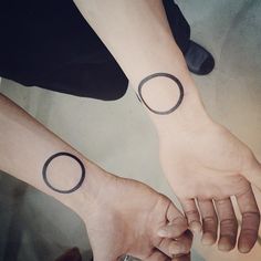 Black Outline Circle Tattoo On Both Wrist