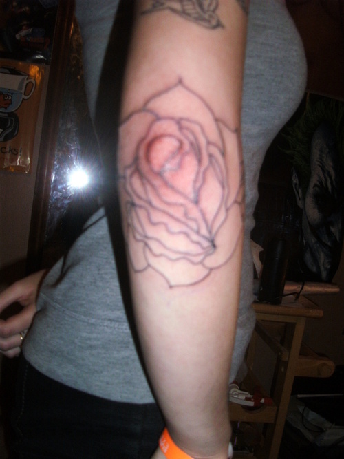 Black Outline Rose Tattoo On Elbow