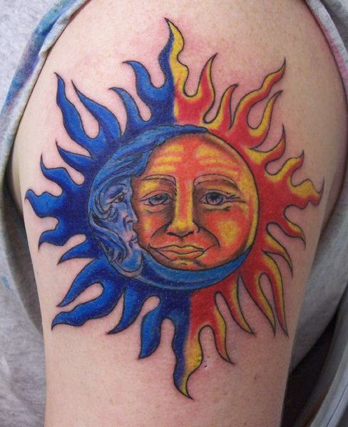 Blue And Red Taino Sun Tattoo On Left Shoulder For Men