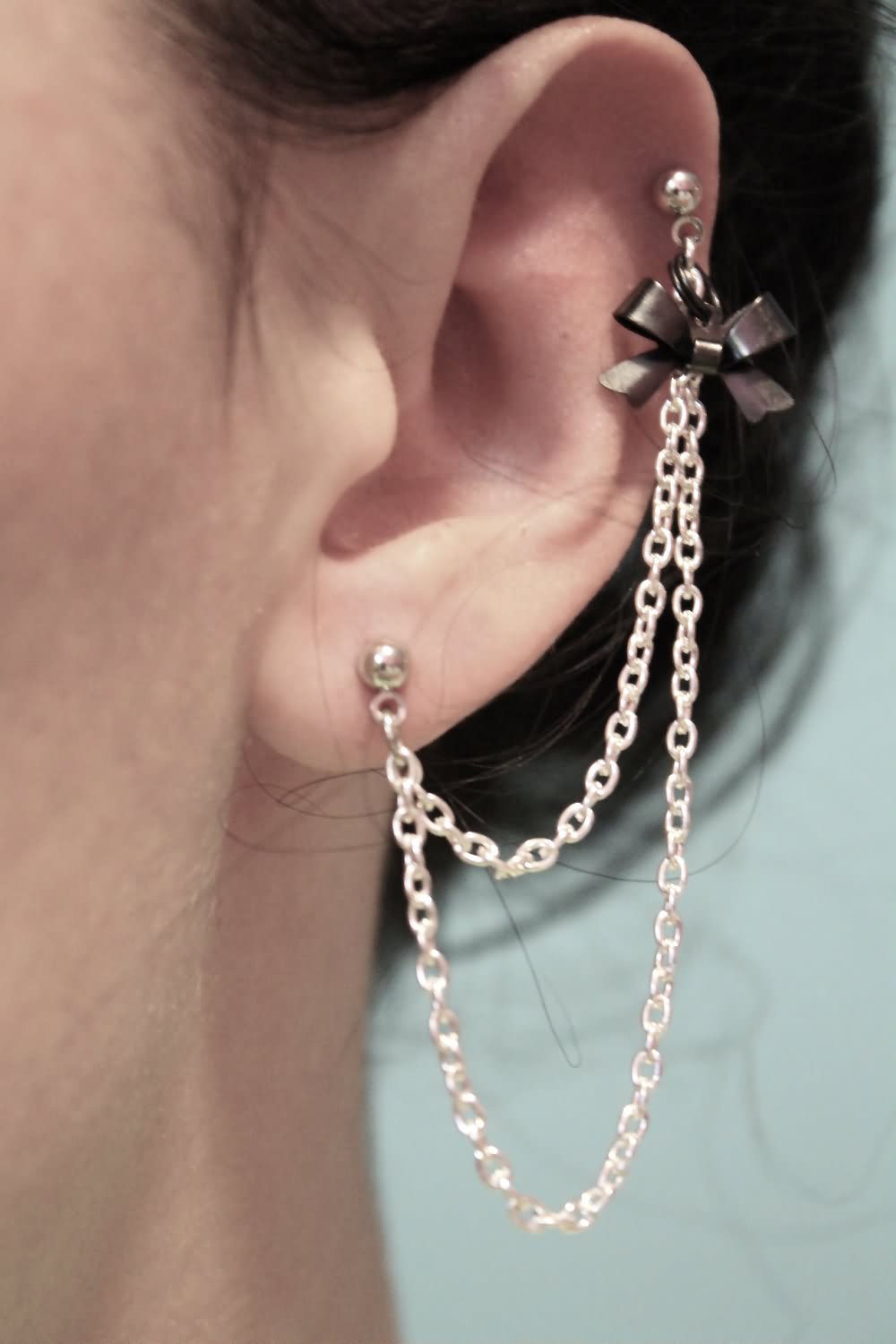 Bow Chain Piercing On Left Ear