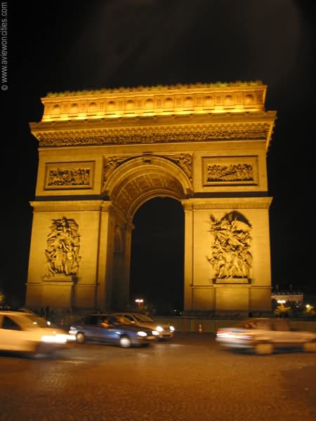 Cars Passing From The Arc de Triomphe At Night