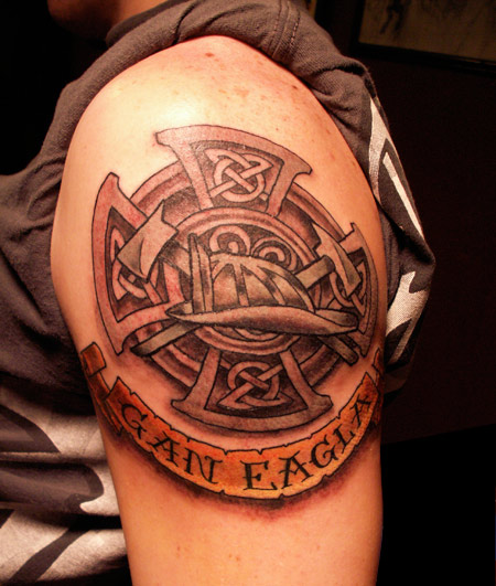 Celtic Cross With Firefighter Helmet And Banner Tattoo On Shoulder