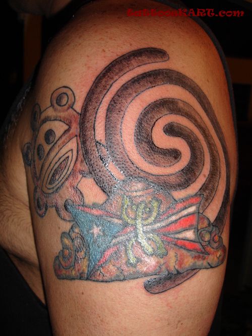 Coil And Taino Sun Tattoos On Left Shoulder