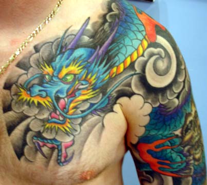 Colored Dragon Fantasy Tattoo On Front Shoulder