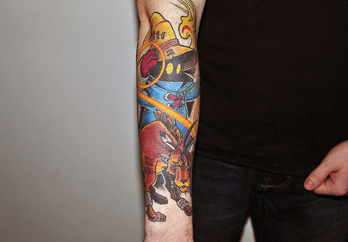 Colored Fantasy Tattoo On Man Right Sleeve