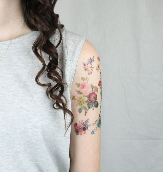 Colorful Floral Tattoo On Girl Left Half Sleeve