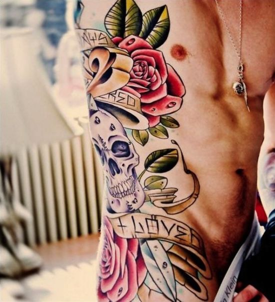 Colorful Floral With Skull And Banner Tattoo On Man Side Rib