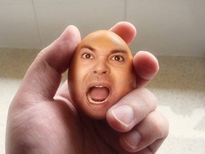 Egg Head In Hand Funny Picture