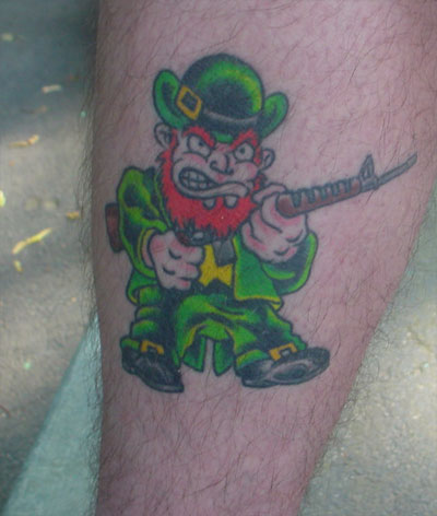 Evil Leprechaun With Gun Tattoo On Leg