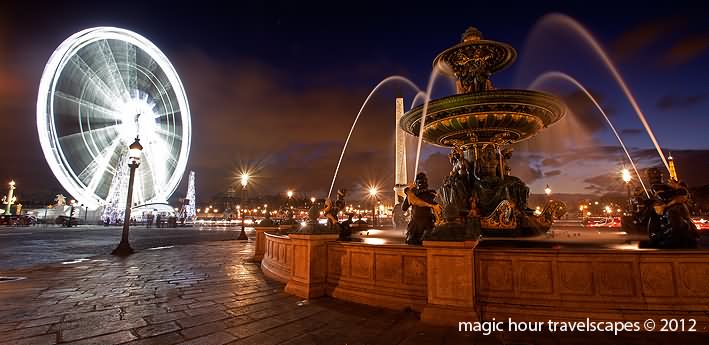 Ferris Wheel And Fountain At Place de la Concorde Night View