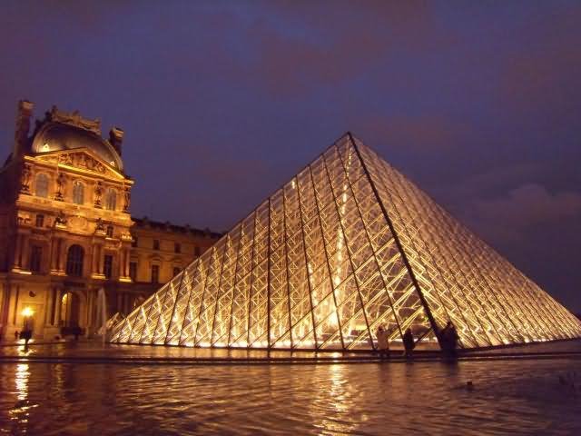 Glass Pyramid And Louvre Museum At Night