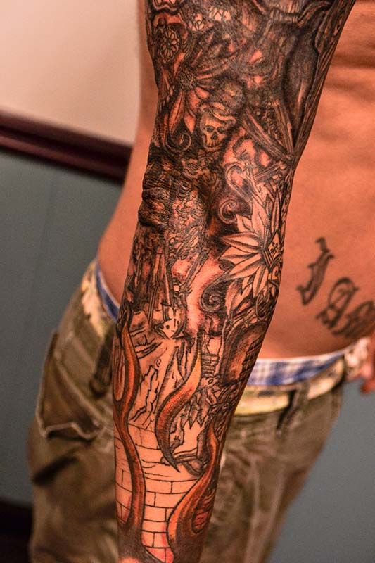 Grey Flowers And Fantasy Tattoo On Sleeve For Men