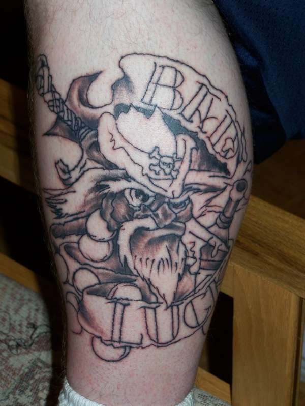 Grey Ink Bad Luck Banner And Leprechaun Tattoo On Leg