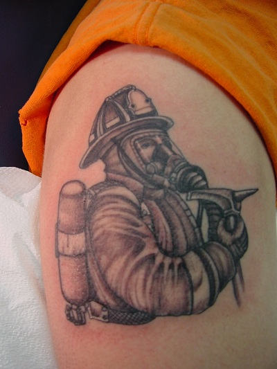 Grey Ink Firefighter Tattoo Design For Shoulder