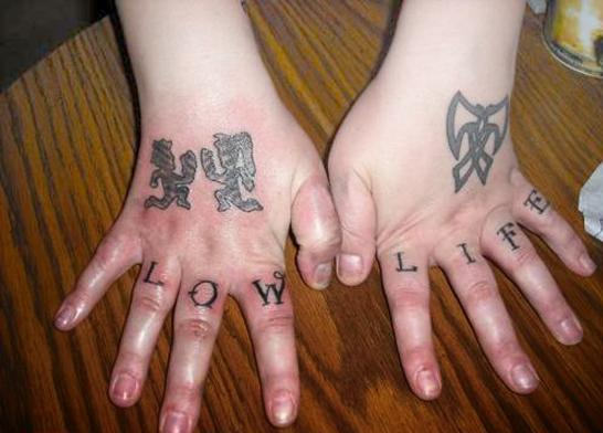 Grey Ink Juggalo Couple Tattoos On Hands