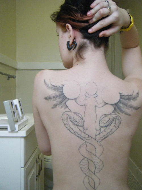 Grey Ink Medical Symbol Tattoo On Girl Full Back