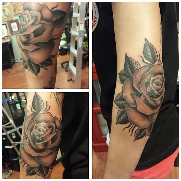 Grey Ink Rose Tattoo On Left Elbow