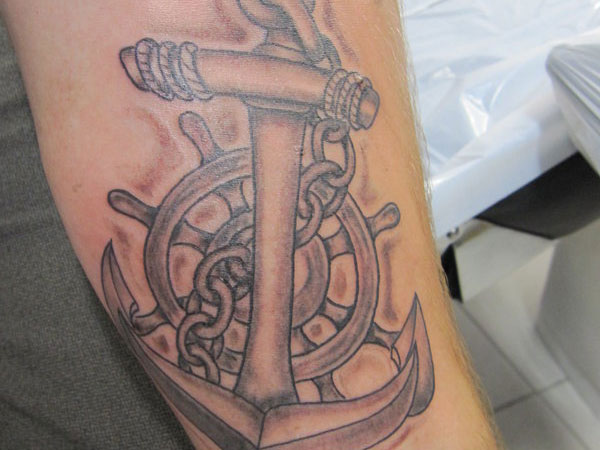 Grey Ink Sailor Anchor With Wheel Tattoo Design For Half Sleeve
