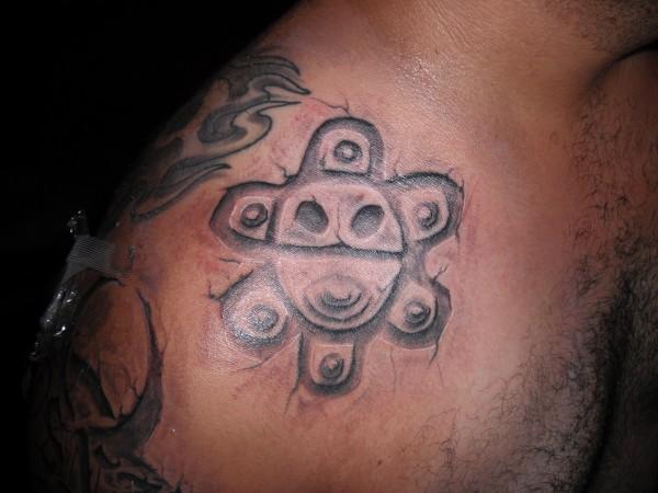 Grey Ink Taino Sun Tattoo On Man Right Shoulder
