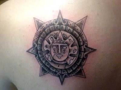 Grey Taino Sun Tattoo On Left Back Shoulder