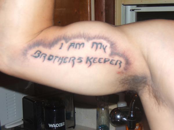 I Am My Brothers Keeper Lettering Tattoo On Bicep
