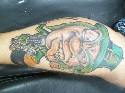Leprechaun Face Tattoo On Leg