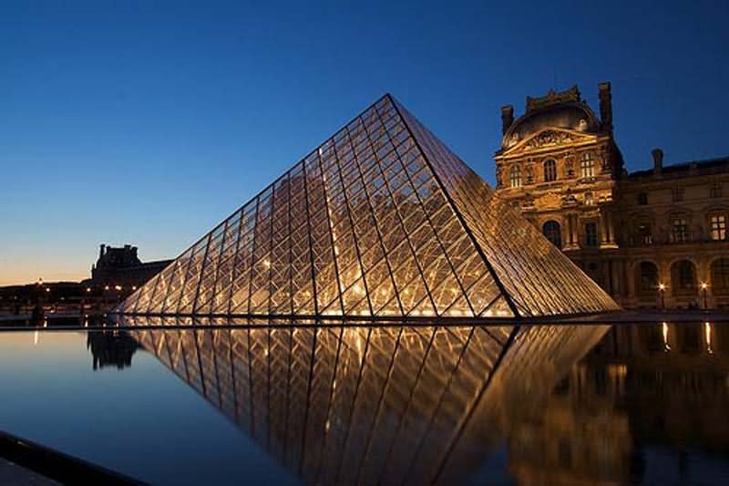Louvre Museum And Glass Pyramid At Night
