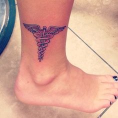 Medical Symbol Tattoo On Girl Leg