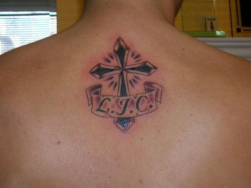 Memorial Black Cross With Banner Tattoo On Upper Back